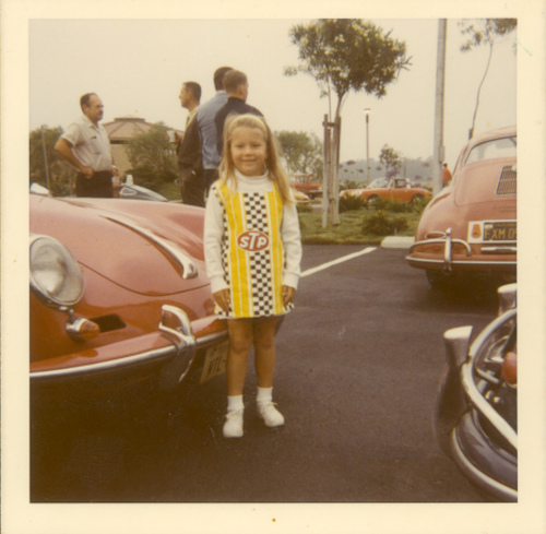 Glenda (at age 6) in her racing dress with her daddy's porsche
